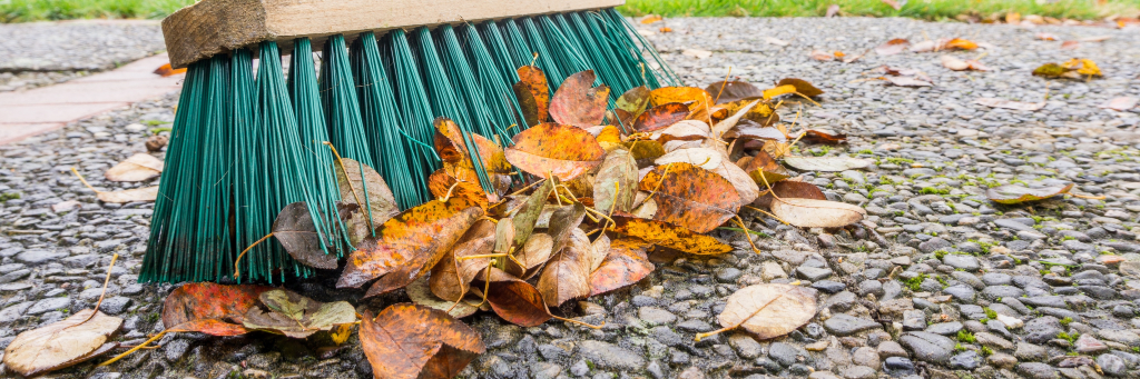 Brushing leaves off patio